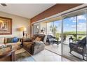Living room with access to a screened-in balcony at 6450 Shoreline Dr # 9105, St Petersburg, FL 33708