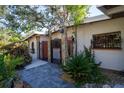 Inviting home exterior with a charming gate and walkway at 2406 S Clark Ave, Tampa, FL 33629