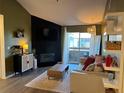 Living room with fireplace and access to balcony at 10263 Gandy N Blvd # 2114, St Petersburg, FL 33702