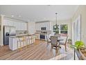 Modern kitchen with white cabinets and island at 6435 Finance Ave, Weeki Wachee, FL 34607