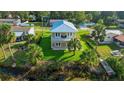 Elevated view of two-story home near the water at 6435 Finance Ave, Weeki Wachee, FL 34607