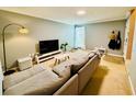 Living room with sectional sofa and TV at 724 Haven Pl, Tarpon Springs, FL 34689