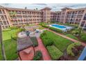 A lovely view of the outdoor pool and recreational space at this inviting condo community at 6100 Gulfport S Blvd # 316, Gulfport, FL 33707