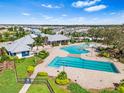 Community pool with lap lanes and a separate recreational area at 12941 Wildflower Meadow Dr, Riverview, FL 33579