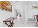 Bright entryway with tile floors, console table, and view to living area at 12941 Wildflower Meadow Dr, Riverview, FL 33579