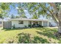 Single-story home with a nicely landscaped front yard at 5410 Palm Drive, New Port Richey, FL 34652