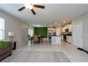 Open concept kitchen and dining area with stainless steel appliances and an island at 10348 Blue Plume Ct, Riverview, FL 33578