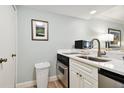 Small kitchen with white cabinets and quartz countertop at 36750 Us Highway 19 # 21212, Palm Harbor, FL 34684