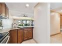 Modern kitchen with granite countertops and wood cabinets at 36750 Us Highway 19 N # 19106, Palm Harbor, FL 34684