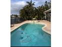 Inviting freeform pool with spa; ideal for relaxation and entertaining at 2017 Iowa Ne Ave, St Petersburg, FL 33703