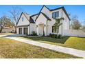 Charming curb appeal featuring lush greenery, a sidewalk, and a freshly painted home exterior at 3914 W Angeles St, Tampa, FL 33629