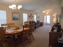 Bright living and dining area with neutral decor at 18833 Bent Pine Dr, Hudson, FL 34667