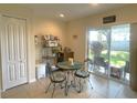 Breakfast nook with sliding glass doors leading to patio at 18833 Bent Pine Dr, Hudson, FL 34667