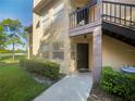 Private condo entry with walkway and landscaping at 2400 Feather Sound Dr # 211, Clearwater, FL 33762