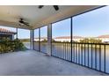 Spacious screened balcony overlooking a tranquil lake at 20180 Ragazza Cir # 201, Venice, FL 34293