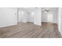 Spacious living room with light grey wood-look flooring at 404 E Morgan St, Brandon, FL 33510