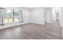 Bright living room with vinyl flooring and large windows at 404 E Morgan St, Brandon, FL 33510