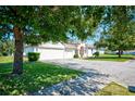 Two-story home with a two-car garage and mature trees at 13267 Linzia Ln, Spring Hill, FL 34609