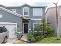 Gray two-story house with a black front door and landscaping at 7749 75Th N St, Pinellas Park, FL 33781