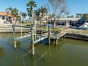 Private dock with boat lift on a canal at 11480 4Th E St, Treasure Island, FL 33706