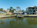 Private dock with boat lift, waterfront view at 11480 4Th E St, Treasure Island, FL 33706