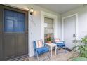 Cozy front porch with seating for relaxing at 12400 Dearborn Dr # F, Hudson, FL 34667