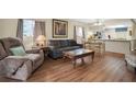 Spacious living room with hardwood floors and ample natural light at 12400 Dearborn Dr # F, Hudson, FL 34667