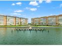 Picturesque waterfront condominiums with manicured lawns and private boat docks at 5200 Brittany S Dr # 1202, St Petersburg, FL 33715