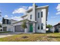 Modern two-story house with green door and gray exterior at 3119 W Cypress St, Tampa, FL 33607