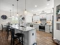 Open concept kitchen boasting granite countertops and an island at 14173 Pullman Dr, Spring Hill, FL 34609