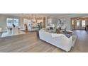 Open living space showcasing hardwood floors and kitchen views at 2919 W Elrod Ave, Tampa, FL 33611