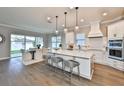 Modern kitchen with white cabinets, large island, and stainless steel appliances at 2919 W Elrod Ave, Tampa, FL 33611