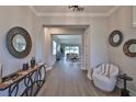 Bright and airy entryway with hardwood floors and stylish decor at 2919 W Elrod Ave, Tampa, FL 33611