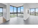 Bright living room with large windows offering scenic views at 500 N Osceola Ave # 802, Clearwater, FL 33755