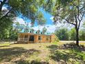 Spacious house nestled on a large lot with mature trees at 26240 Willow St, Brooksville, FL 34601