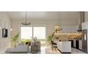 Open-concept kitchen and living area with modern appliances and an island at 4026 Yucatan Cir, Port Charlotte, FL 33948
