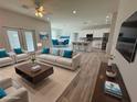 Open concept living room and kitchen with hardwood floors at 37570 Teri Ct, Dade City, FL 33525