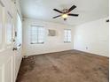 Spacious bedroom with neutral carpeting and ceiling fan at 1318 Preston S St, St Petersburg, FL 33712