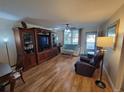 Living room with hardwood floors, furniture, and access to balcony at 4895 Bay Ne St # 215, St Petersburg, FL 33703
