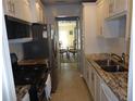 Bright kitchen with granite countertops and stainless steel appliances at 3128 59Th S St # 209, Gulfport, FL 33707