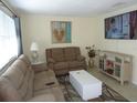 Comfortable living room with two recliners and a large TV at 3128 59Th S St # 209, Gulfport, FL 33707
