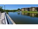 Scenic pond with a fountain, surrounded by well-manicured lawns and residential buildings at 4336 Bayside Village Dr # 201, Tampa, FL 33615