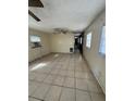 Spacious living area with tile floors and hallway at 411 S Orleans Ave, Tampa, FL 33606
