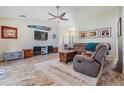 Spacious living room featuring tile floors, a large TV, and comfortable seating at 1002 Pondview Ct, Tarpon Springs, FL 34689