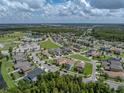 Aerial view of home and community amenities at 8720 Savory Walk Dr, Land O Lakes, FL 34637