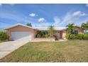 Single story home with attached garage and landscaped yard at 1301 Sea Gull S Dr, St Petersburg, FL 33707