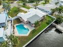 Aerial view showcasing waterfront home with private pool at 1301 Sea Gull S Dr, St Petersburg, FL 33707