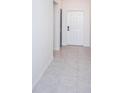 Bright and airy hallway with tile floors at 14906 Imperial Purple Ln, Wimauma, FL 33598