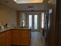 Kitchen with granite countertops, wooden cabinets and stainless steel appliances at 13936 Clubhouse Cir # 13936, Tampa, FL 33618