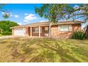 House exterior showcasing a ranch style home with a covered porch at 5621 Moog Rd, New Port Richey, FL 34652